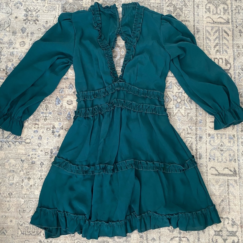 Vibrant dark green dress with sexy back.